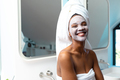 Portrait of cheerful young african american woman with face cream on face in bathroom, copy space - PhotoDune Item for Sale