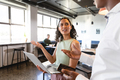 Multiracial young businessman and businesswoman discussing in creative office - PhotoDune Item for Sale