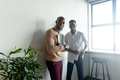 Portrait of smiling african american businessmen standing in creative office - PhotoDune Item for Sale