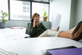 Young asian creative businesswoman examining document while talking on mobile phone in office - PhotoDune Item for Sale