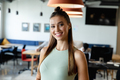 Portrait of smiling young caucasian businesswoman in creative office - PhotoDune Item for Sale