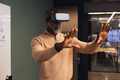 Mature african american businessman using virtual reality simulator gesturing at creative office - PhotoDune Item for Sale
