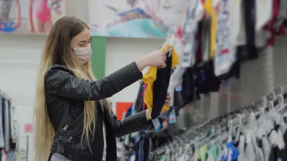 She is so Happy to Buy New Clothes for Kid