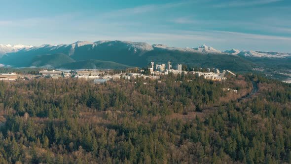 Aerial view of Simon Fraser University on a hill and mountains on background in British Columbia, Va