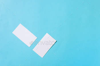 ockup template with shadows on blue paper background. Place your design.
