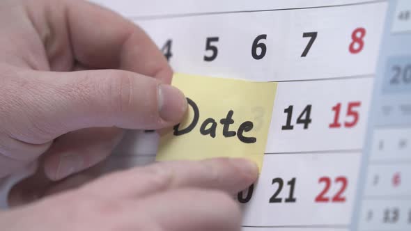 The Hand Sticks a Reminder on the Calendar About the Meeting