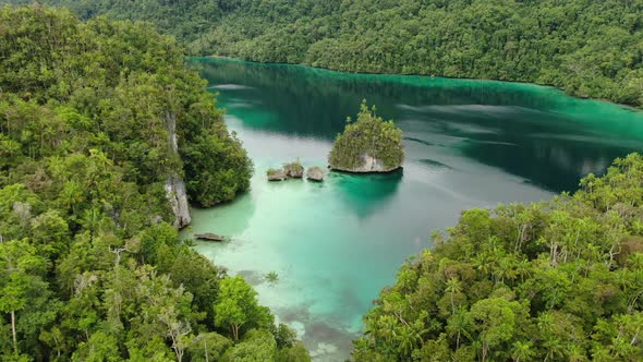 Triton Bay With Turquoise Sea And Green Tropical Trees In Kaimana Islands