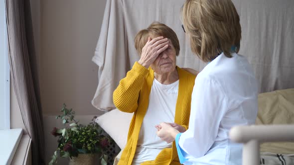 Doctor Visits Senior Patient At Home. Senior Home Assistance, Elderly Care Concept