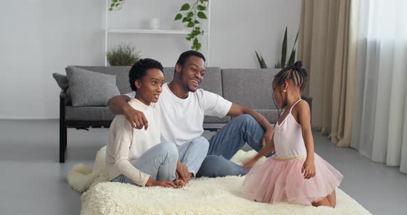 Afro American Family with Daughters in Princess Dress Spend Time Together in New House Renters 