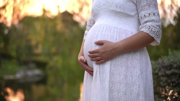 Pregnant Woman Feeling Happy at Garden Home