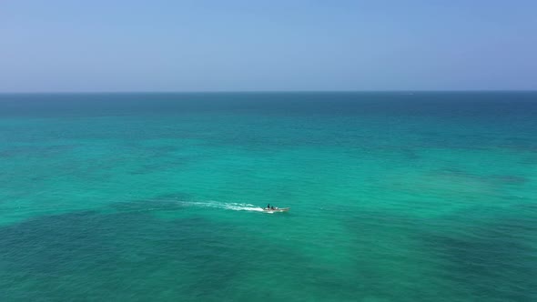 A Pleasure Boat Takes Tourists on an Excursion in the Open Ocean