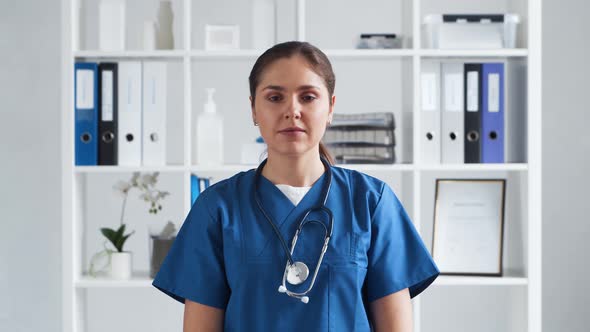 Professional medical doctor working in hospital office. Young and attractive female physician.