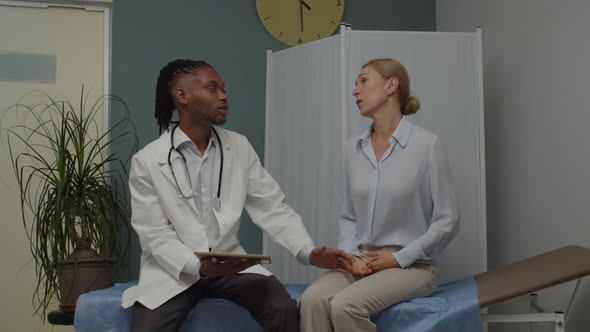 Desperate Female Patient Crying Not Believing to Bad News Indoors