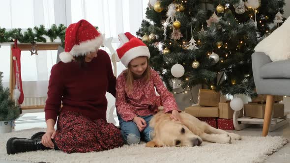 Mother and Daughter in Santa Hats