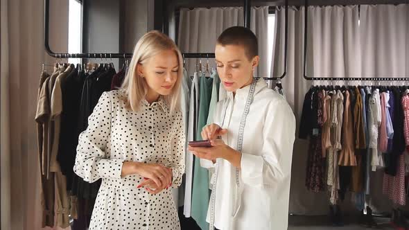 Woman Fashion Designer Discuss with Buyer