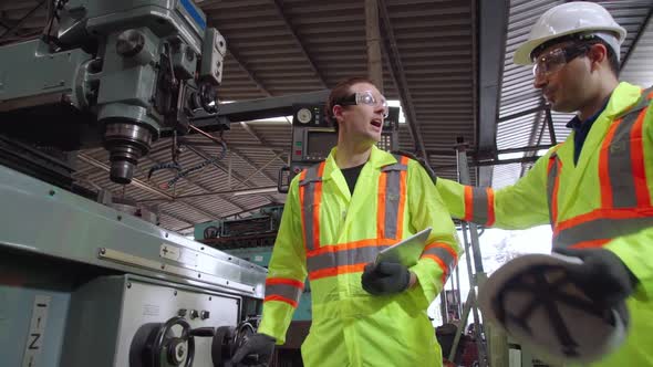 Factory Worker Warn Coworker About Safety and Give Hardhat to Him