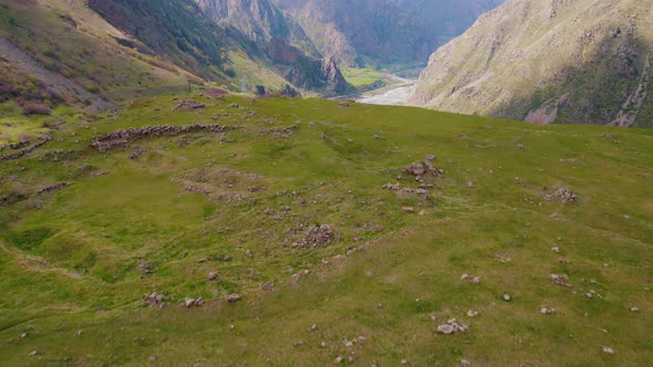 Closeup Aerial View of a Mountain Meadow and Dariali Gorge in the Distance Georgia