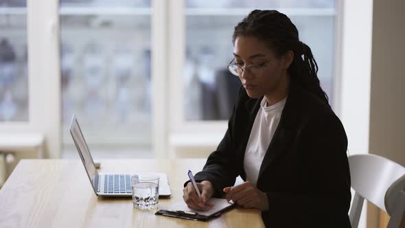 Afro American Girl Secretary Business Woman Sitting at Table at Office Using Laptop