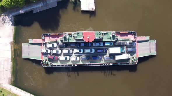 top down view of ferryboat transferring cars. Ferry transfers cars and passengers to the other side
