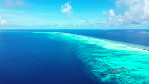 Tropical fly over island view of a white sand paradise beach and aqua turquoise water background 