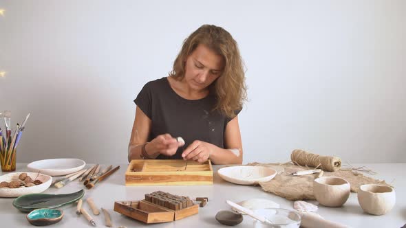 Sculptor Working in a Workshop. Art and Handicraft Modelling Creation.