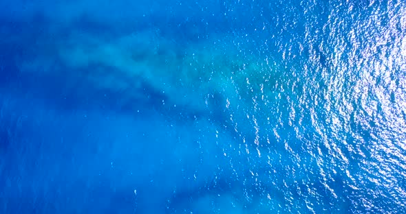 Luxury overhead travel shot of a summer white paradise sand beach and turquoise sea background in hi