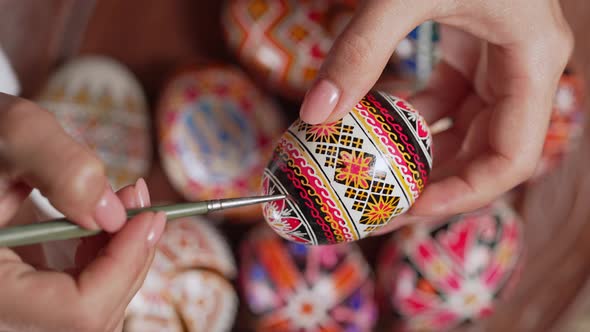 Ukrainian Woman Painting Traditional Ornamets on Easter Egg  Pysanka