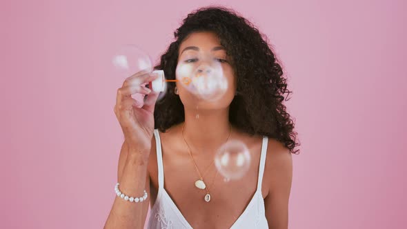 Young Ethnic Black Woman in Jewelry and White Dress