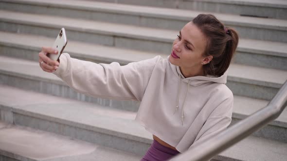 Selfie By Smartphone Woman is Using Modern Gadget for Photographing Herself