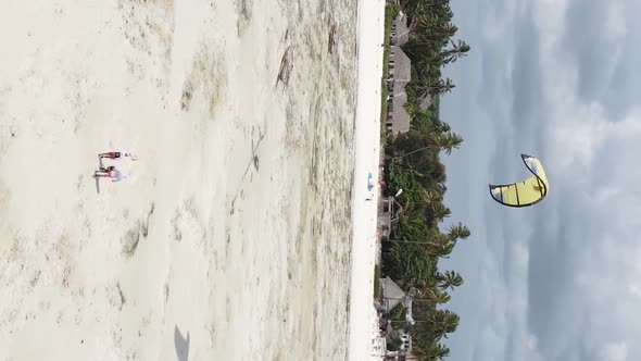 Vertical Video Kitesurfing Near the Shore of Zanzibar Tanzania Aerial View