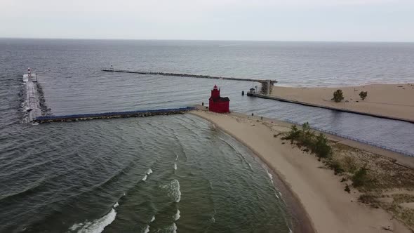 Aerial Flying Towards Red Lighthouse on Lake in Michigan