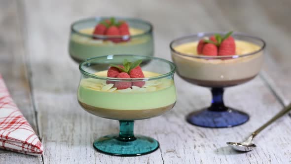 Chocolate Caramel Dessert In Glasses With Raspberries. Eating mousse dessert
