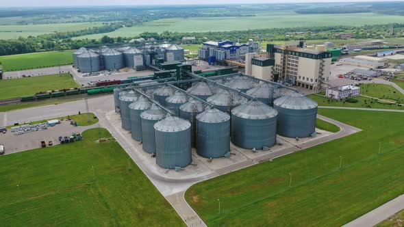 Grain elevator on green landscape