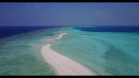 Aerial seascape of idyllic lagoon beach journey by blue ocean and white sand background of a dayout 