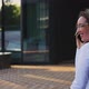 Smiling Female Professional Talking on Smart Phone Outside Office Building - VideoHive Item for Sale