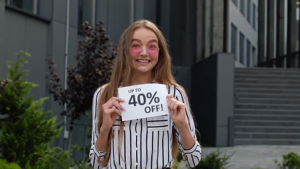 Cheerful Girl Showing Up To 40 Percent Off Text Advertisement. Online Shopping with Low Prices