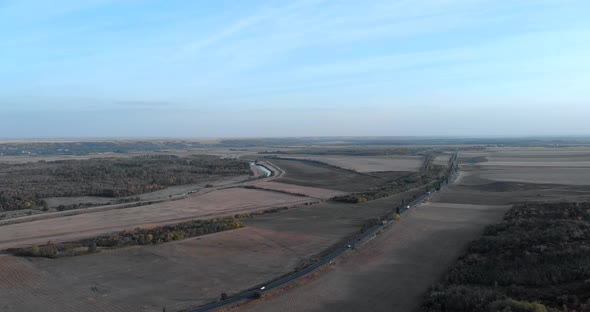 Aerial View Of The Heavy Trucks Traveling On The Rural Road At The Countryside.