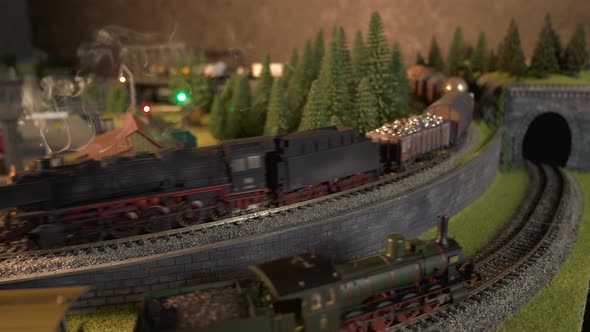 Steam Locomotives Running on Model Railroad.