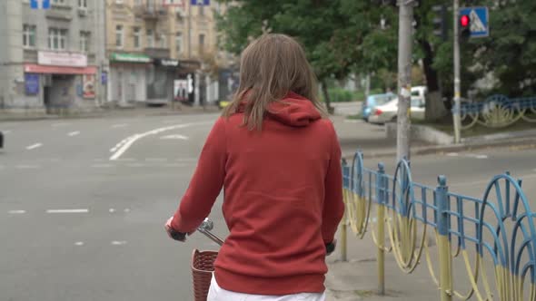 Girl On A Bike In The City