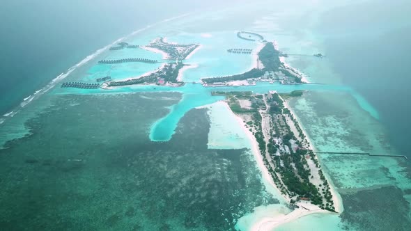 Aerial Drone View of a Beautiful Atoll or Island with a Resort in the Maldives