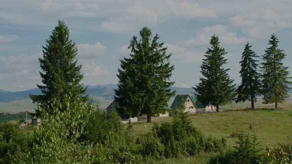 View from the window on the village with houses on the background of fields