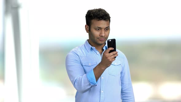 Young Man Taking Photo with Mobile Phone.