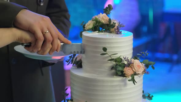 Newlyweds Are Cutting Their First Piece of Cake