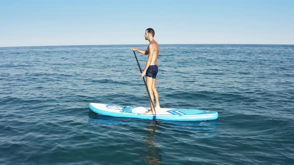 Man On A Stand Up Paddle