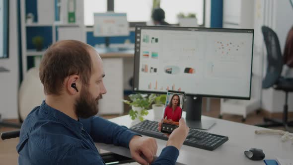 Freelancer with Disabilities Talking on Videocall with Remotely Woman Partner