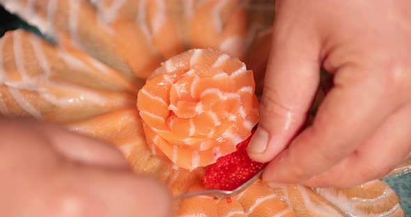 Elegant Sashimi Presentation - Sushi Chef Arranging The Fresh Thin Salmon Sashimi Slices Into Flower