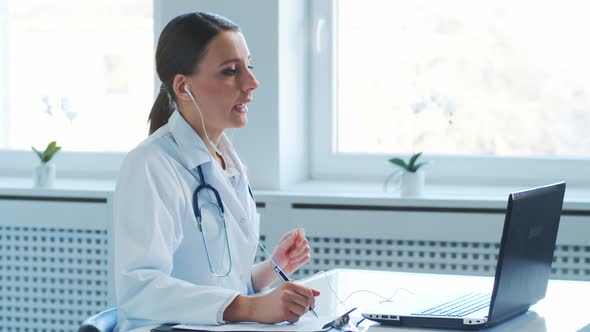 Professional medical doctors working in hospital office making research.