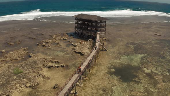 Raised Wooden Walkway for Surfers To Cross the Reef of Siargao Island To Cloud 9 Surf Break in