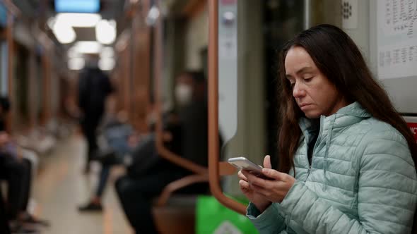 Portrait of a Brunette with Long Hair on the Train