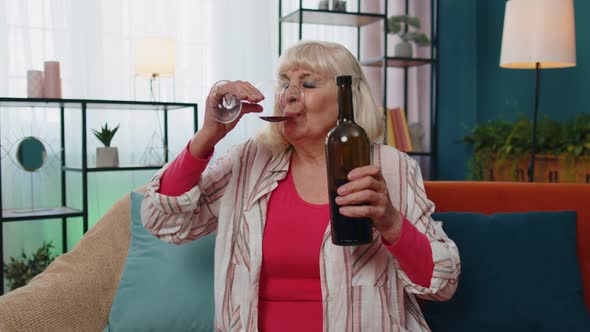 Happy Elderly Grandmother Woman Drinking Red Wine Glass Celebrating Birthday Anniversary Lottery Win